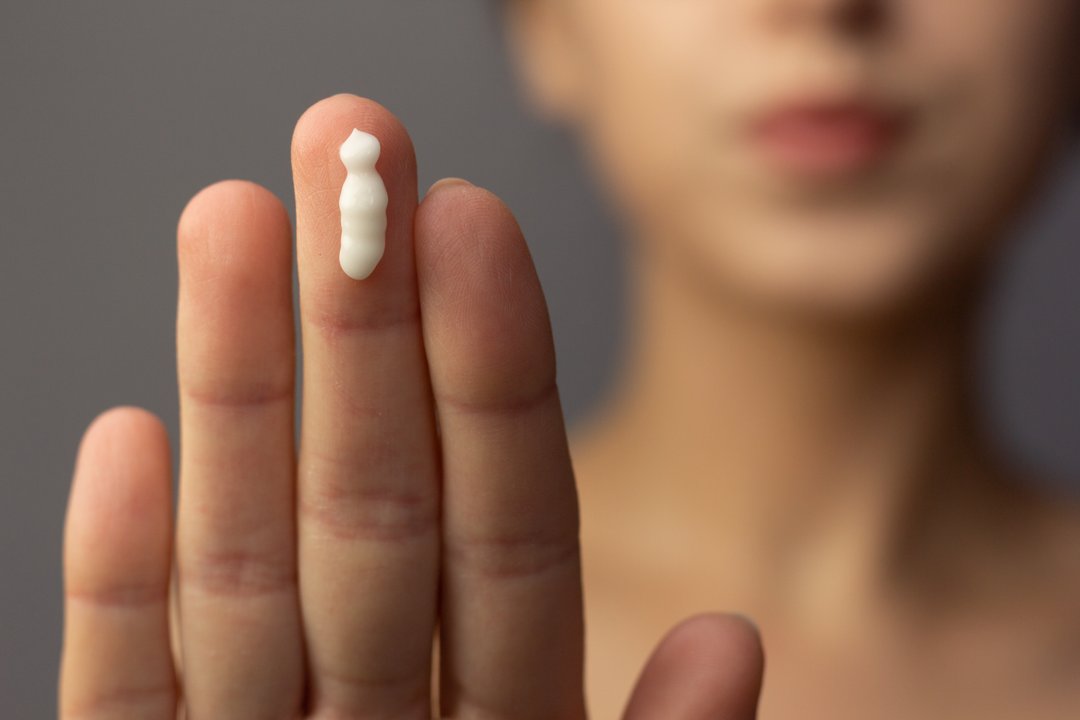 woman's hand with dollop of THC topical