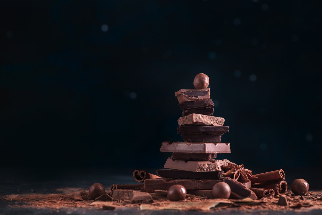 Dark chocolate pieces stacked