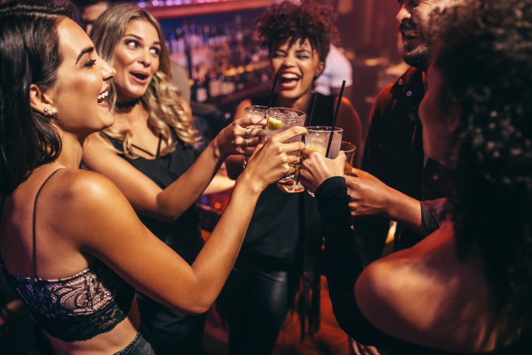 young women socializing over drinks