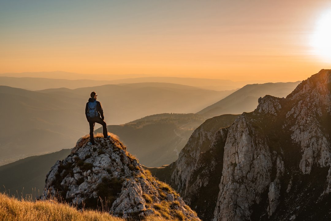 man on mountain-top, symbolizing what its like to be high