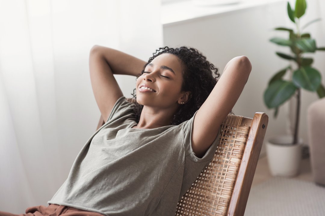 young black woman relaxed yet uplifted