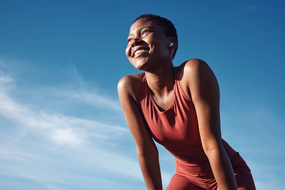 woman on a run smiling