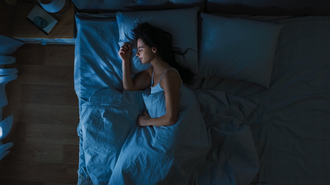 woman peacefully sleeping at night