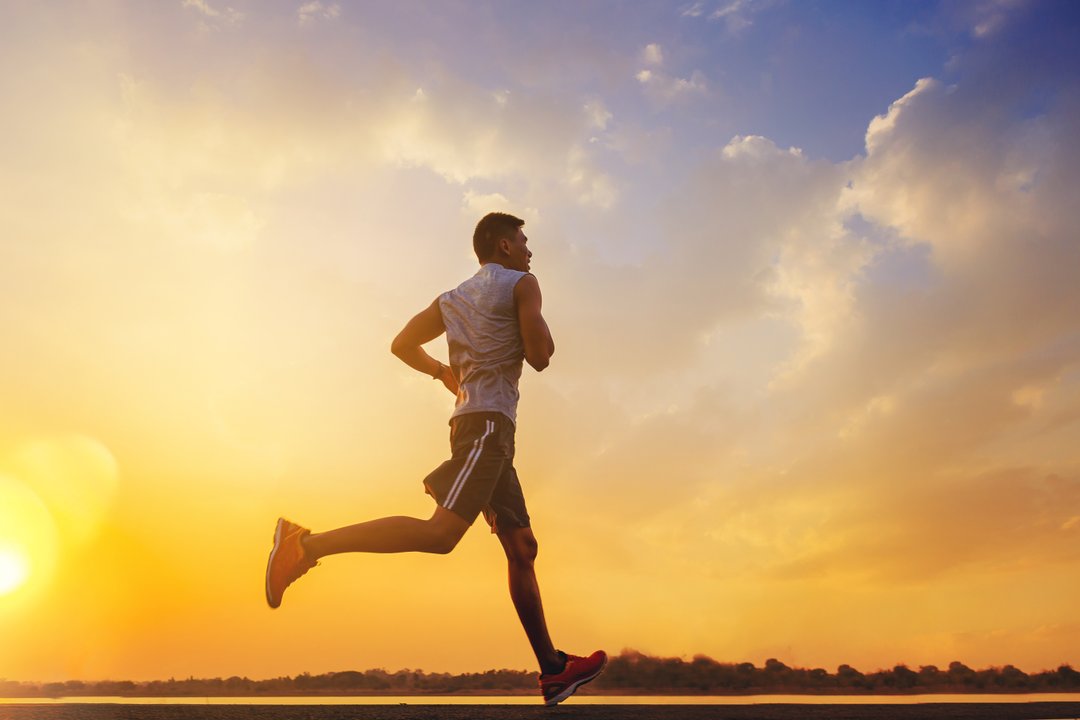 Man running with the sunset view