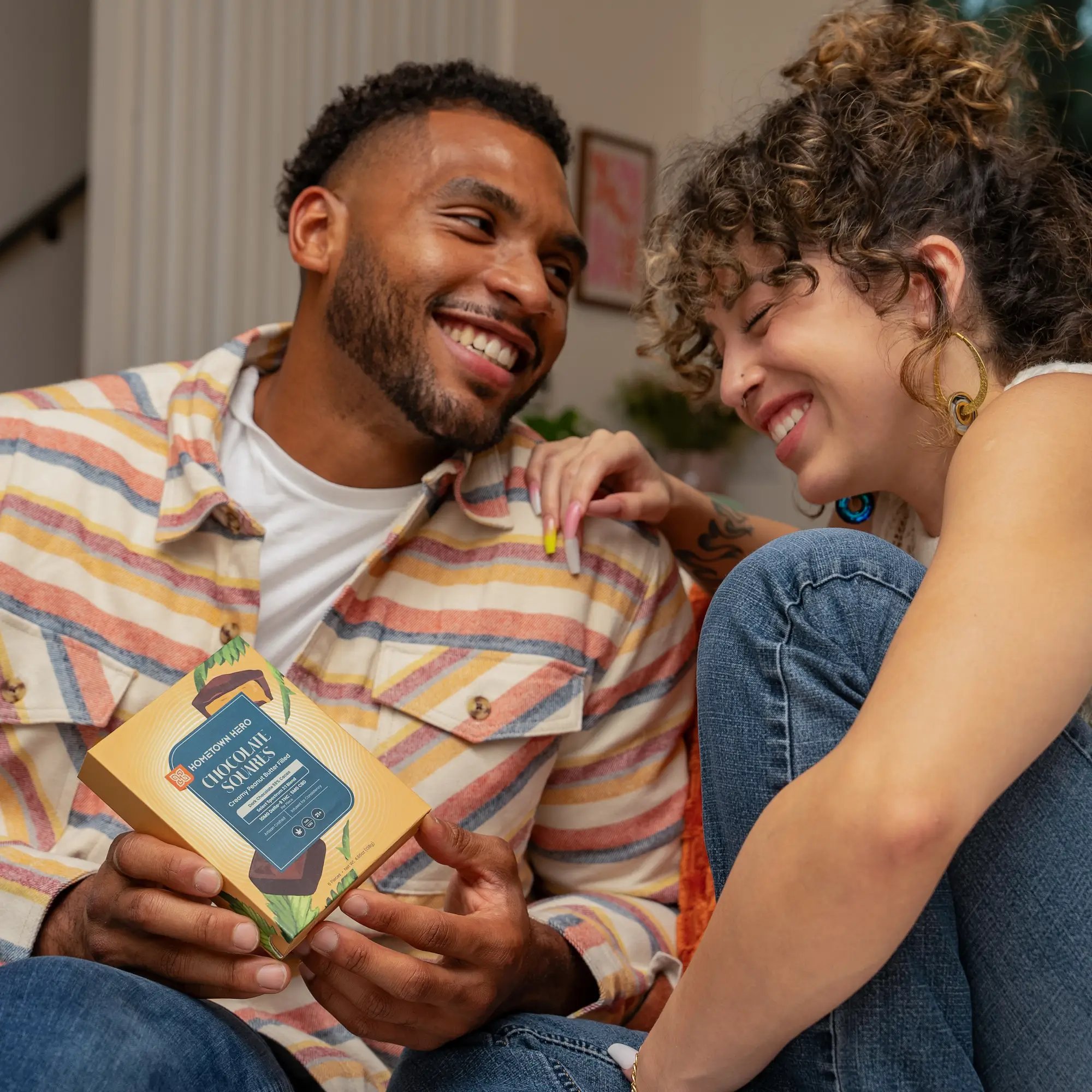 Couple laughing with edibles.