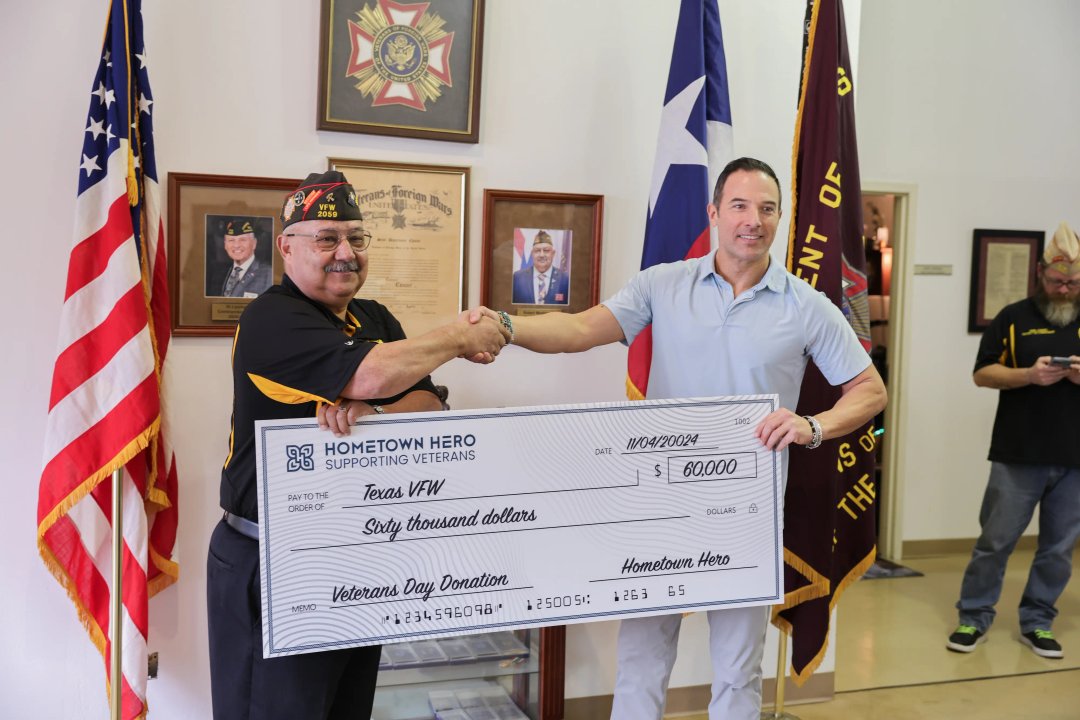 Hometown Hero CEO Lukas gilkey shaking hands with VFW rep