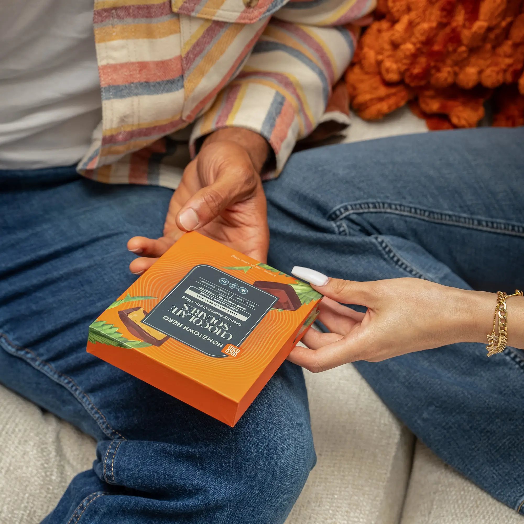 Couples hands holding edibles.