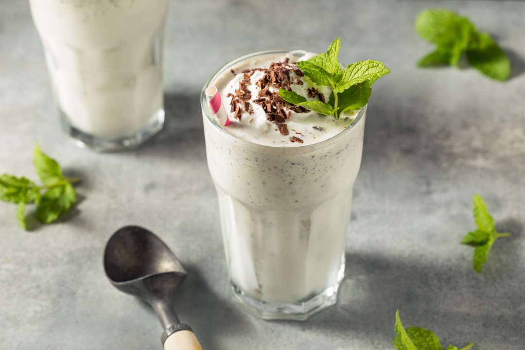 glass with mint milk shake chocolate and whipped cream