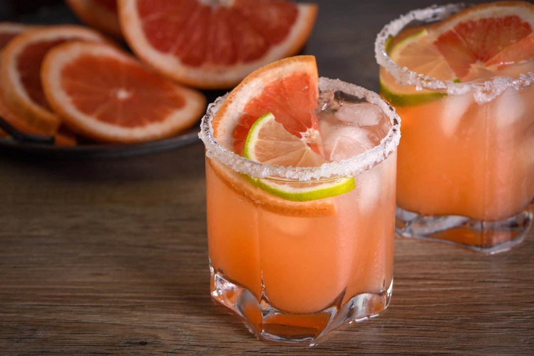 Pink Paloma in a glass, a great grapefruit and tequila cocktail recipe for any party.