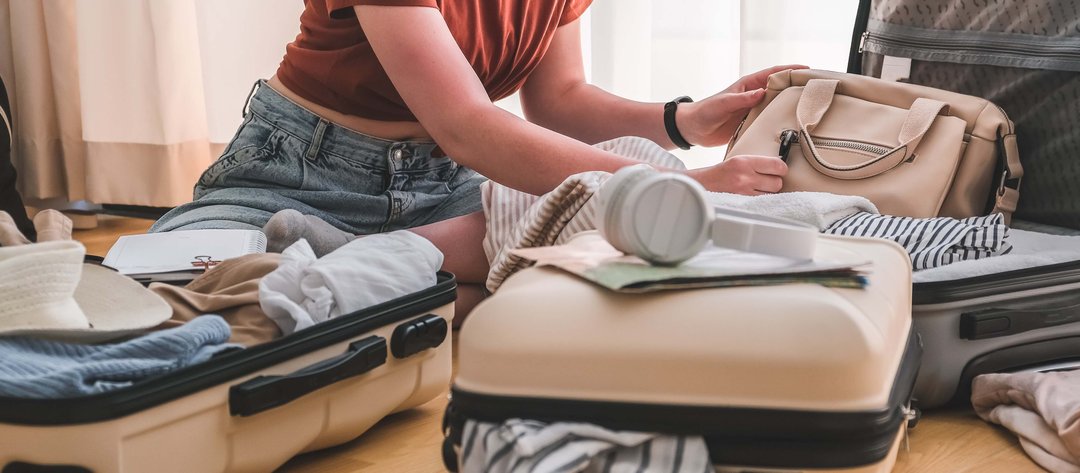 woman packing her suitcase for adventure