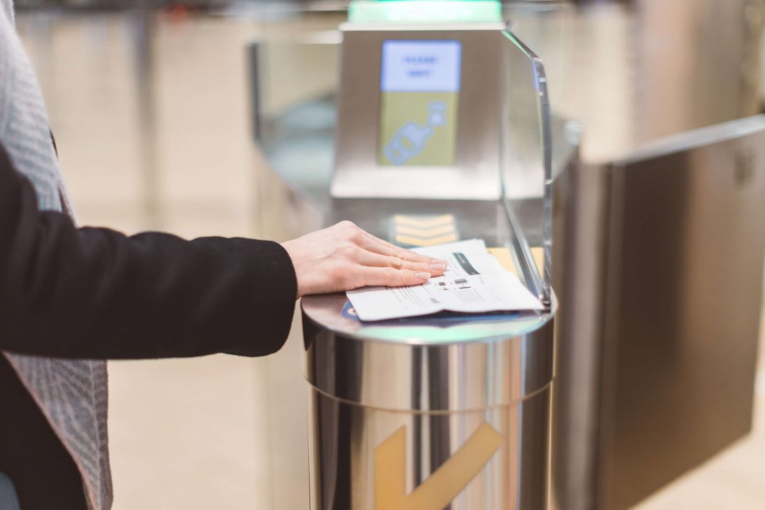 woman scanning pass at airport