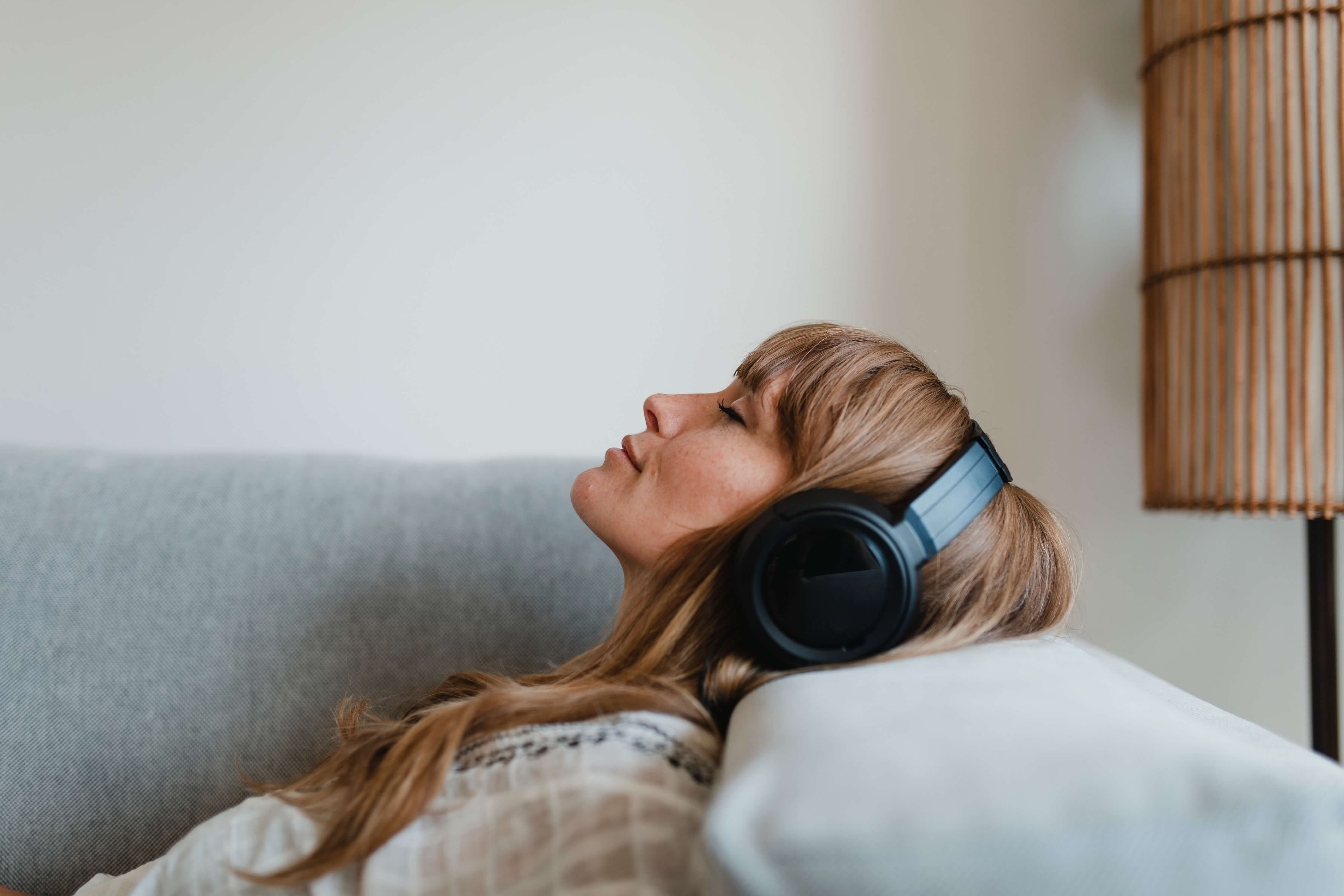 woman listening to music on her headphones