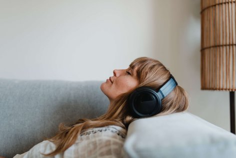 woman listening to music on her headphones