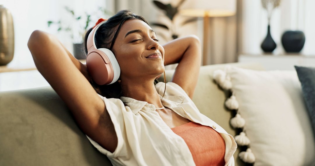 woman enjoying music on her headphones