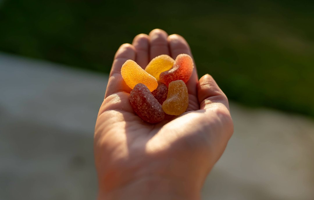 hand holding cannabis infused edibles