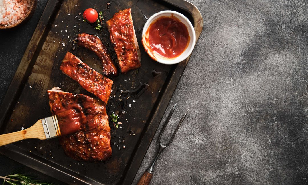 barbecue sauce brushed over ribs