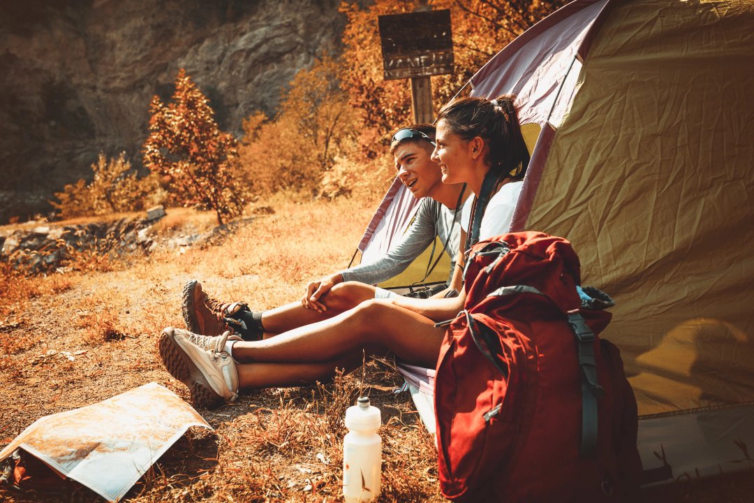 young couple camping in the great outdoors