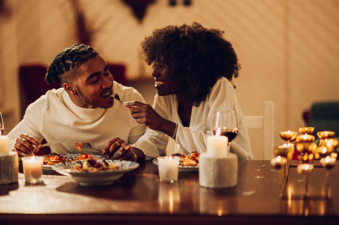 couple enjoying a romantic candelit dinner