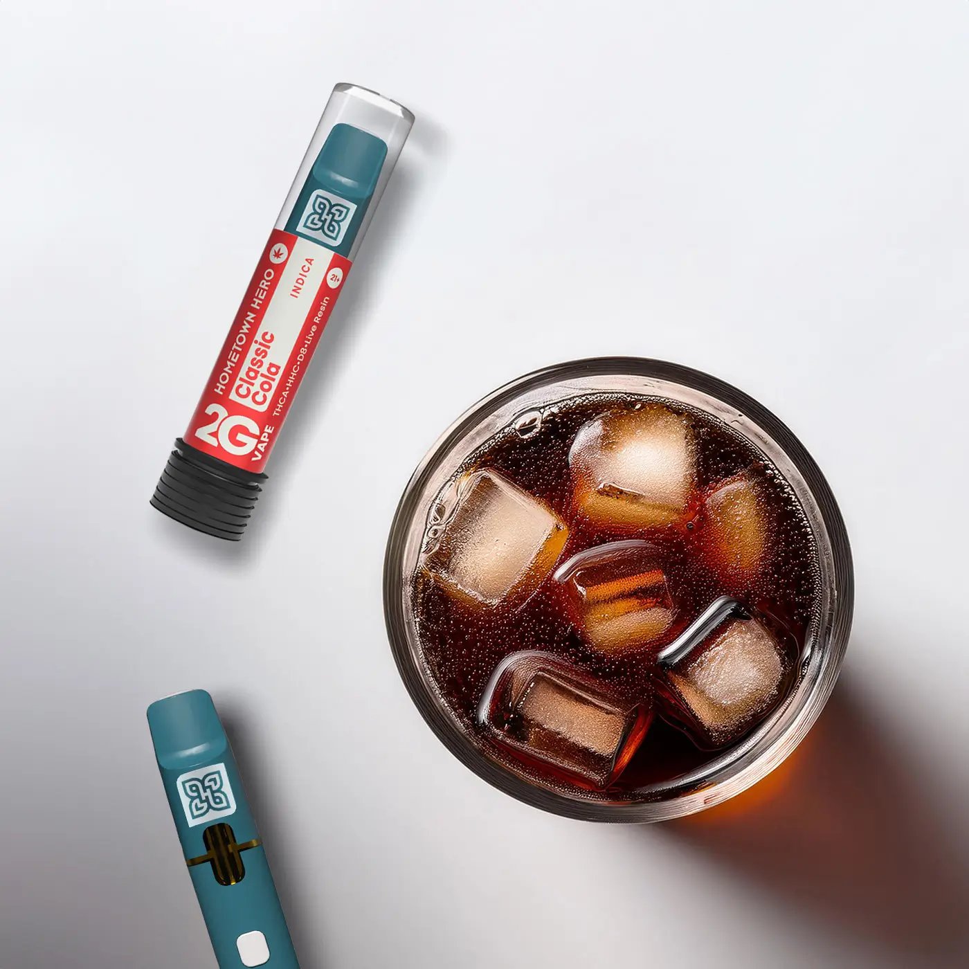 glass of cola and a vape