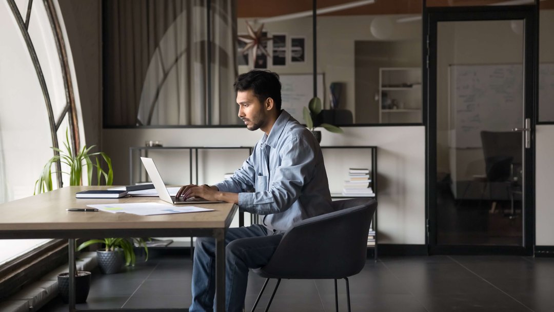 man working on his computer