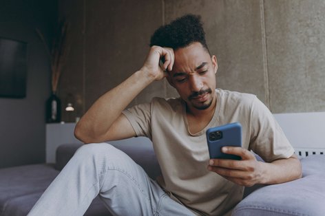 Confused man researching cannabis effects