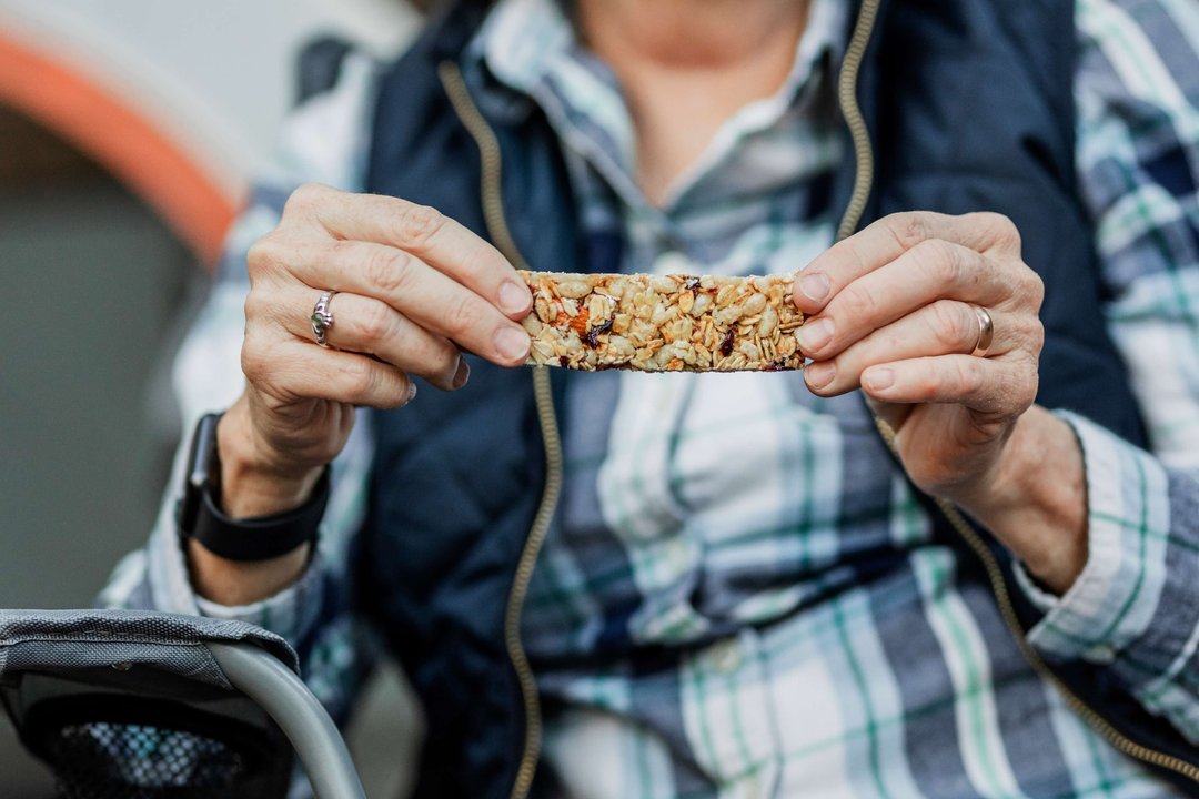 lady holding a granola bar