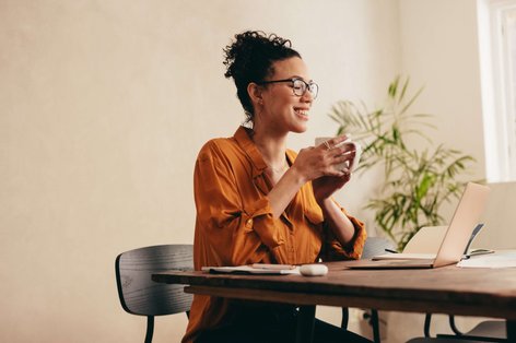 woman working from home, looking happy