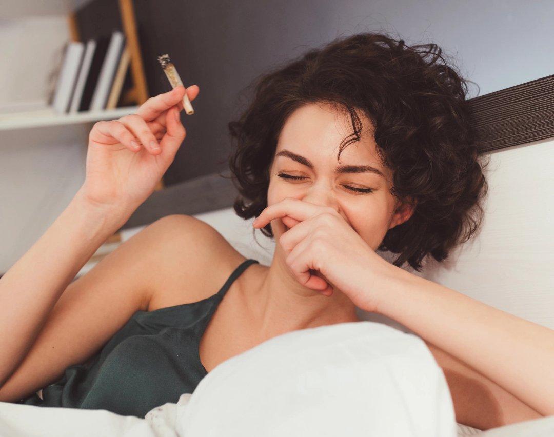 woman laughing with cannabis