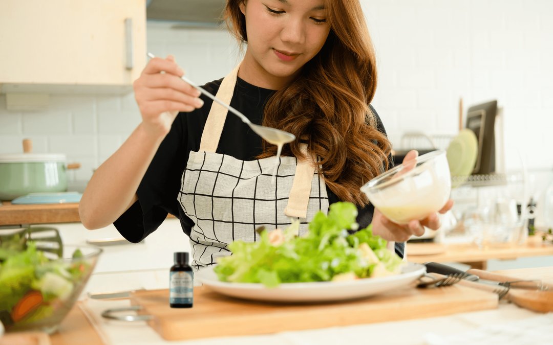 woman mixing her own salad dressing