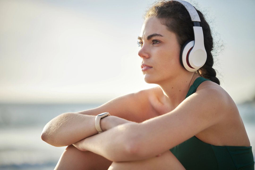 woman listening to music as she enjoys nature