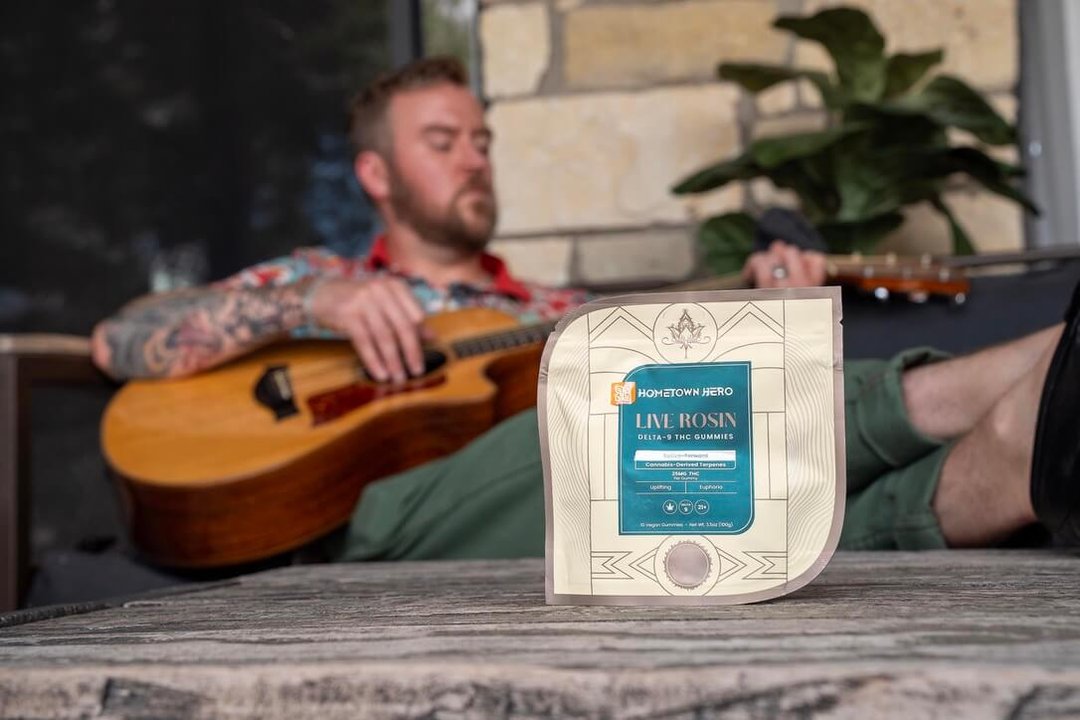 man playing music with sativa
