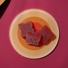 pomegranate raspberry gummies on a plate