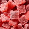 a pile of sugary red gummies