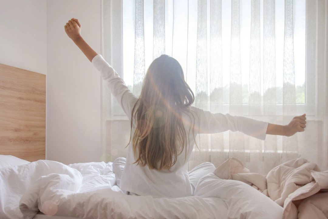 woman stretching in the early morning