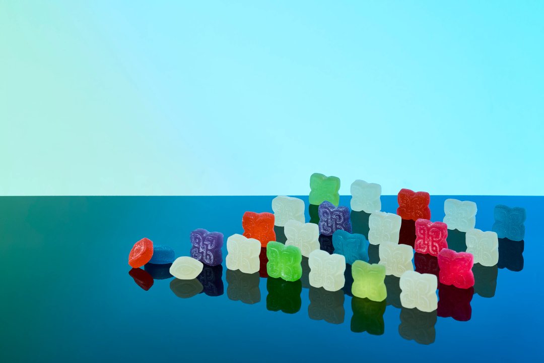 an assortment of edible THC gummies in different colors and shapes