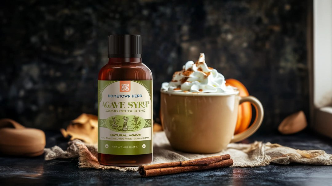 Agave Delta-9 THC syrup bottle beside a pumpkin spice latte.