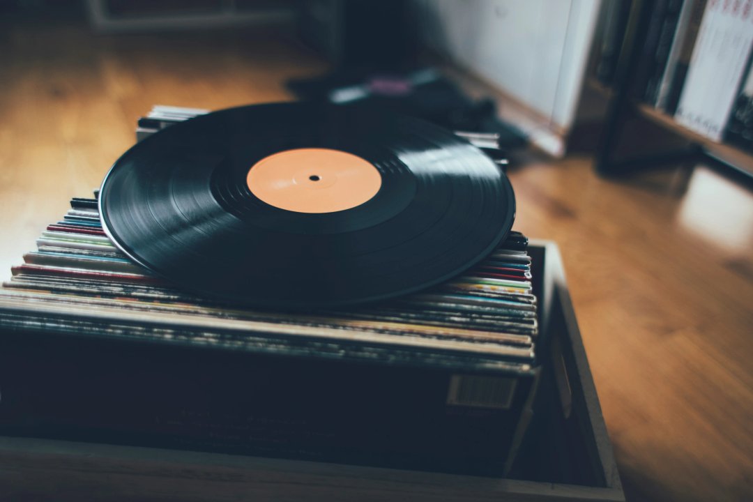 Close up of vinyl record on stack of records collection